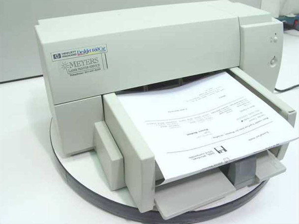 HP DeskJet 660Cse inkjet printer front view with paper tray extended and printed page loaded, showing HP and Meyers Laser Printer Service label on front