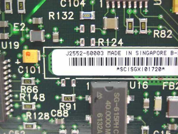 HP J2552-60003 PCB close-up — label reads J2552-60003 Made in Singapore, barcode, and 40 MHz oscillator chip visible