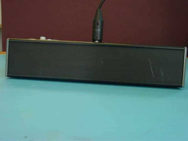 Side profile of Tele Images desktop podium with AT857QMa gooseneck microphone mounted, showing surface scuffing on top panel