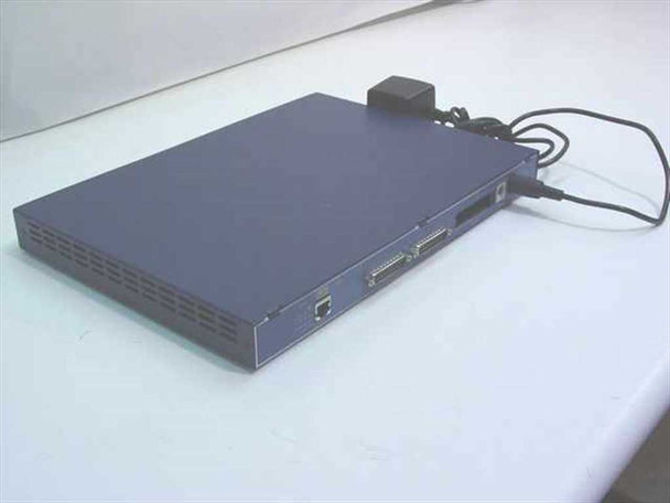 Olicom CF7052 Router rear panel view showing DB-25 serial WAN ports and RJ-45 connector with power adapter connected