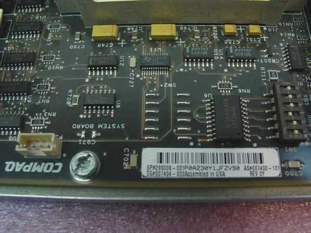 Compaq 299308-001 system board PCB close-up – rear label showing part number SPX299309, Assembled in USA marking, and Compaq logo