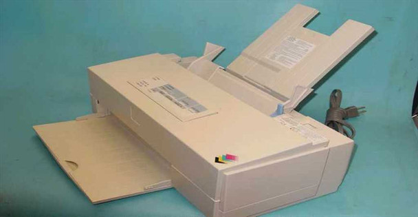 Epson Stylus Color II P880A inkjet printer — three-quarter front-left view with output tray open, paper feed tray raised, and power cord visible at rear