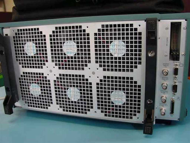 Tektronix TLA704 Logic Analyzer Mainframe rear view — six ventilation fan grilles, rear I/O panel with PC Card slot, dual DB9 connectors, BNC connectors, and rack ears