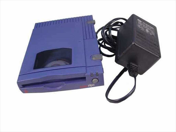Iomega Zip 100 Z100S2 External SCSI Drive front 3/4 view in purple with AC adapter alongside