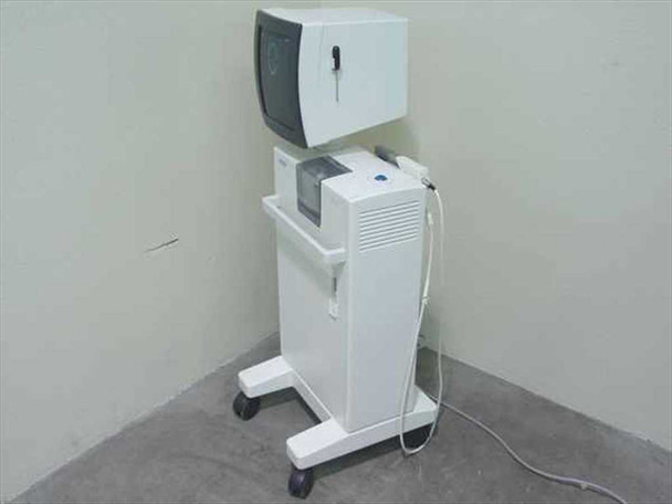 Siemens Sirona Cerec 2 dental milling machine – three-quarter right side view showing cart and monitor