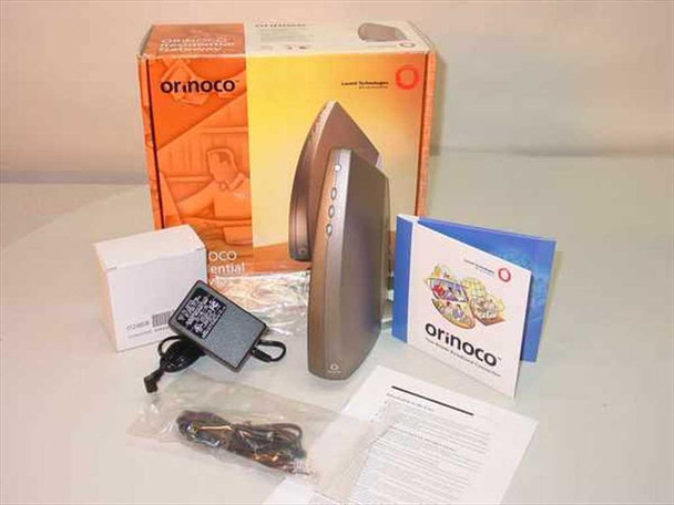 Lucent Orinoco RG-1000 wireless residential gateway with original box, power supply, telephone cable, configuration guide, and CD-ROM laid out