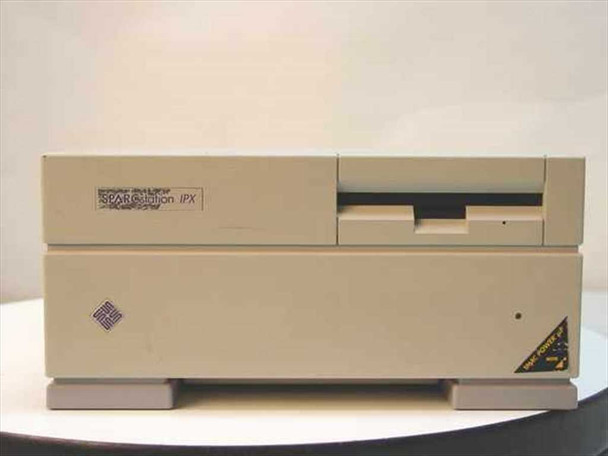 Sun Microsystems SPARCstation IPX front panel view showing 'SPARCstation IPX' badge, 3.5-inch floppy drive, Sun Microsystems diamond logo, and yellow caution label