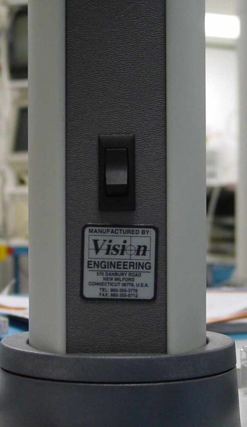 Vision Engineering manufacturer label on Mantis microscope stand column, showing power switch and company address — New Milford, Connecticut, USA