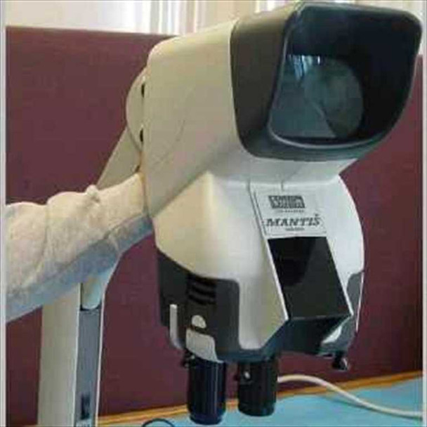 Vision Engineering Mantis stereo microscope on stand, front-left three-quarter view showing large eyepieceless viewing hood and MANTIS nameplate