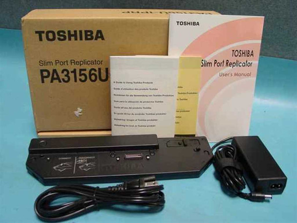 Toshiba PA3156U Slim Port Replicator in OEM box with AC adapter, power cable, and user manual laid out in front