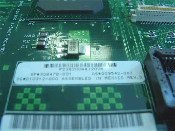 Compaq 338478-001 label closeup showing part number SP#338478-001, AS#009542-003, DC#010312-000, Assembled in Mexico Rev D