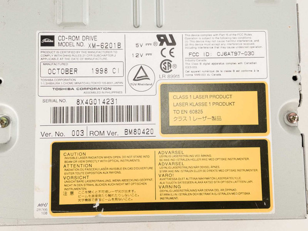 Toshiba XM-6201B label second closeup – showing model XM-6201B, Toshiba Corporation, October 1998, serial 8X4G014231, Ver. 003, ROM BM80420, Class 1 Laser Product markings