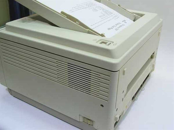 Panasonic KX-P4410 laser printer right-side and rear view showing ventilation grilles and paper output tray with printed page