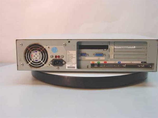 Compaq Presario 7222 desktop computer — rear panel showing power supply fan, AT keyboard port, serial and parallel ports, expansion card slots (ISA and PCI), audio jacks, and IEC power inlet