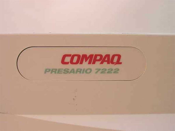 Compaq Presario 7222 close-up of front nameplate showing Compaq logo in red and Presario 7222 model name in teal lettering