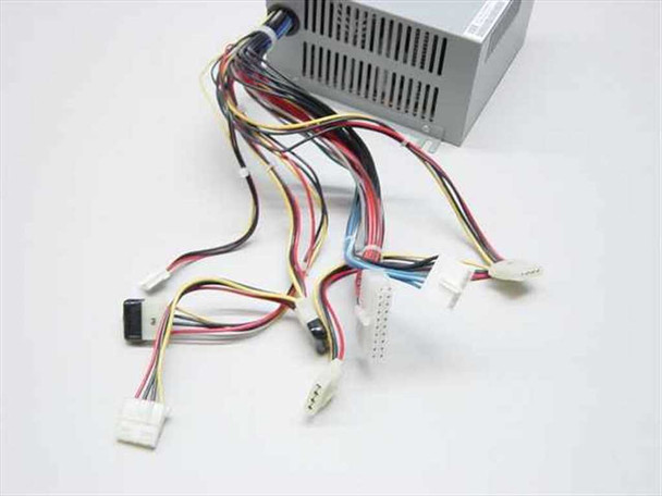 Dell HP-233SNF ATX power supply — close-up of cable harness showing ATX 20-pin main connector, Molex 4-pin, and auxiliary connectors