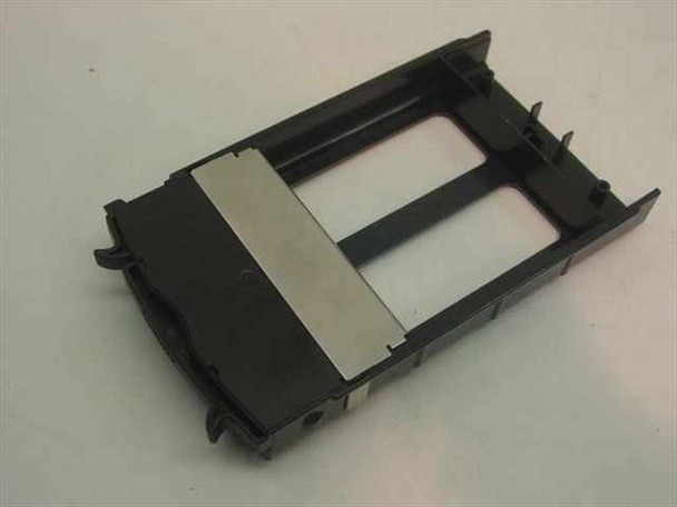 Compaq 349460-001 hard drive blank filler tray — underside view showing metal EMI shield plate and mounting tabs