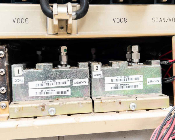 Interior lower card bay showing two SQMF1037A tuning modules labeled AGC/NKPBT in VOC6 and VOC8 slots with SMA-type RF connectors