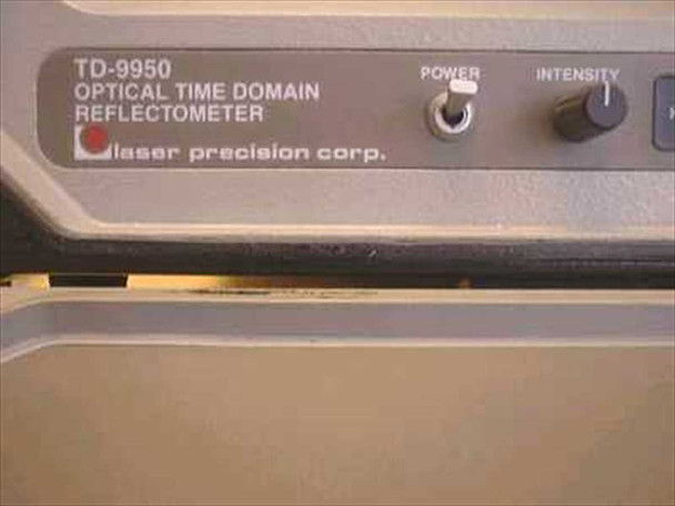 Laser Precision TD-9950 nameplate close-up reading 'TD-9950 Optical Time Domain Reflectometer — laser precision corp.' with Power and Intensity controls visible