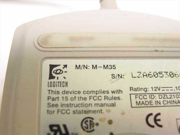 Logitech M-M35 bottom label closeup showing model number M-M35, serial number, FCC ID, 12V rating, and Made in China markings