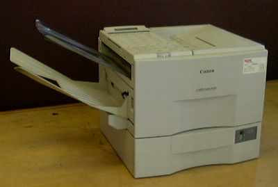 Canon Laser Class 8500 H12101 plain paper laser fax machine — front and left side view showing paper trays and document feeder