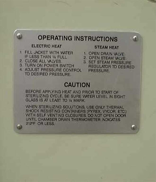 American Sterilizer Portaclave operating instructions and caution placard — dual-mode instructions for electric heat and steam heat, safety warnings for sterilizing cycle
