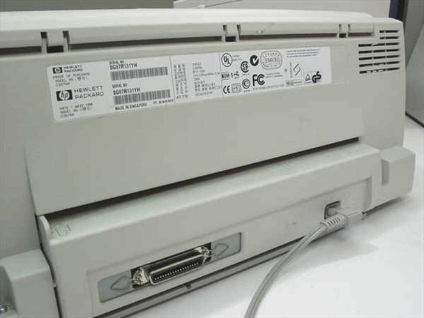 HP DeskJet 1120C – rear panel view showing IEEE 1284 parallel port with connected cable and regulatory label