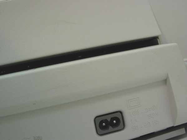 HP DeskJet 1120C – side detail showing IEC power inlet and power/voltage specification label (110-240V, 50/60Hz)