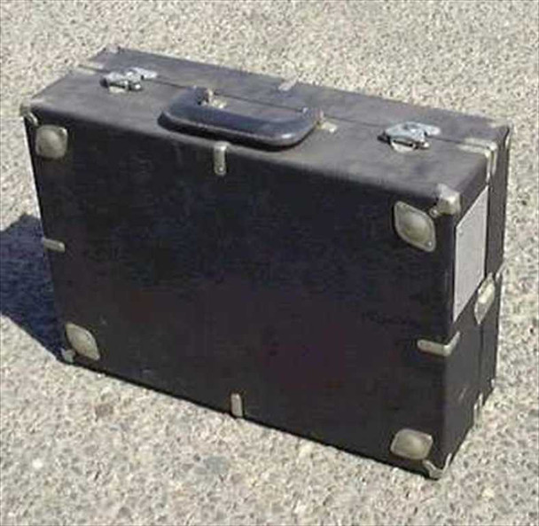 Eagle hard-shell flight road case closed — black laminate exterior with steel corner protectors, padded handle, and butterfly latches visible