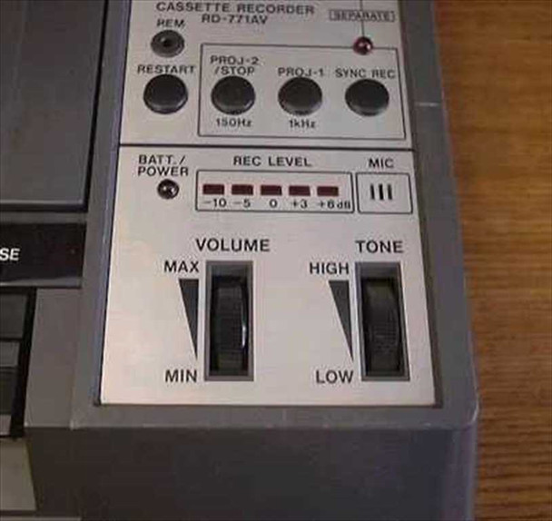 Sharp RD-771AV lower control panel showing Batt/Power switch, Record Level VU meter (-10 to +6dB), MIC indicator, and Volume and Tone sliders