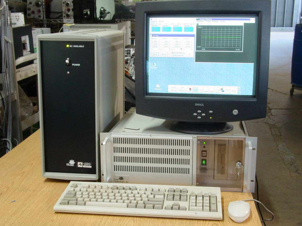 Lotus Technologies 7100 CSS system – system running with monitor showing CSS software interface with green graph traces, keyboard and mouse connected, confirming OS/2 boot and software operation