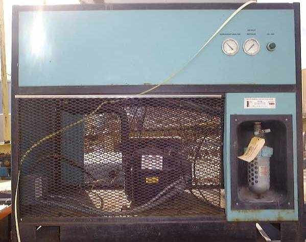 Wilkerson A08-HH-P00 Refrigerated Air Dryer — front view showing blue cabinet enclosure with mesh lower panel, visible compressor motor, two top-mounted gauges, and right-side filter separator assembly