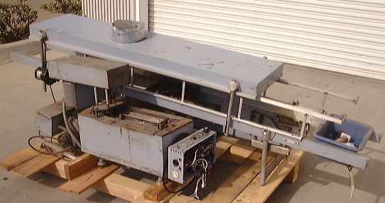 Technical Devices Mark I-C wave soldering machine – full machine view from end angle showing complete conveyor, solder pot section, exhaust fan, and flux tray