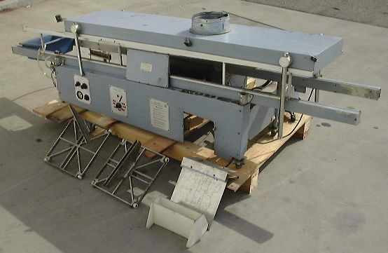 Technical Devices Mark I-C wave soldering machine – full front/side view on pallet with conveyor rails, exhaust hood on top, and flux tray at front