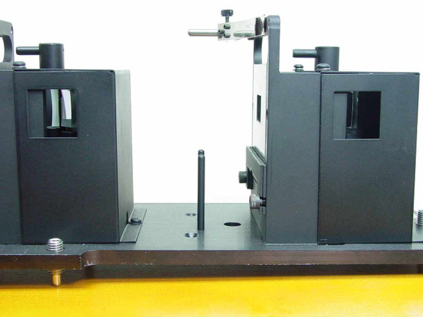 Applied Magnetics EL97083713 dual alignment modules on base plate — close-up of gap between the two fixture blocks showing apertures and guide pins