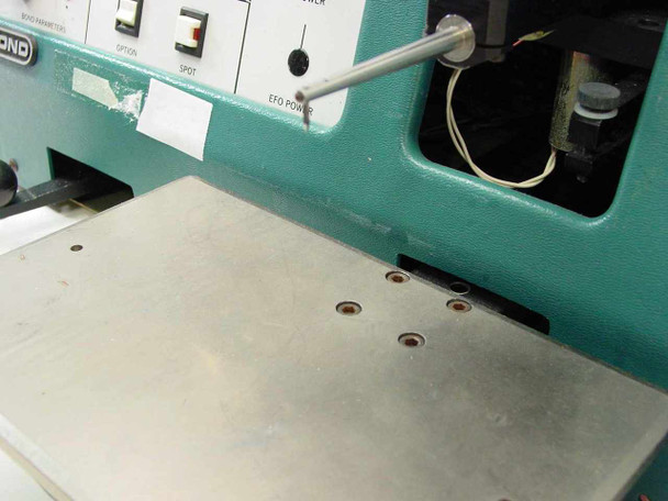 HyBond 512-10-41 bonding work table surface showing mounting holes and EFO power wiring area behind right side of panel