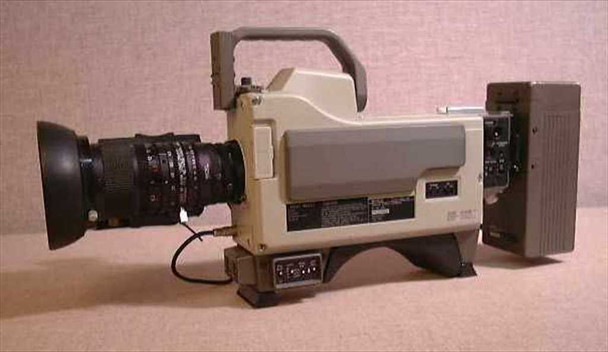 Canon J15X9.5 B4 KRS broadcast lens on Sony DXC camera — right-side profile view showing camera body side panel, control connectors, and full lens assembly