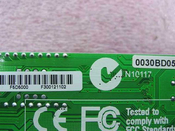 Belkin F5D5000 PCB label close-up showing model number F5D5000, part number F300121102, and FCC compliance text