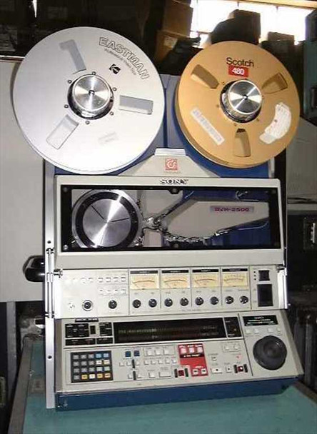 Sony BVH-2500 1-inch broadcast VTR front view with Eastman and Scotch 480 tape reels loaded, front panel controls, VU meters, and transport section visible