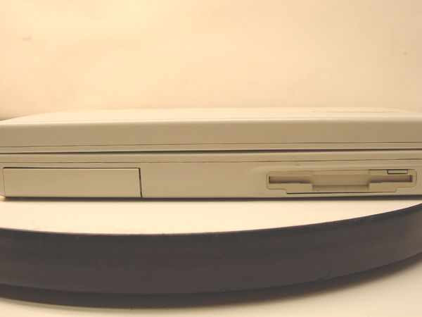 Toshiba Satellite T1960CT/320 right side view showing CD/HDD bay and 1.44MB floppy drive slot