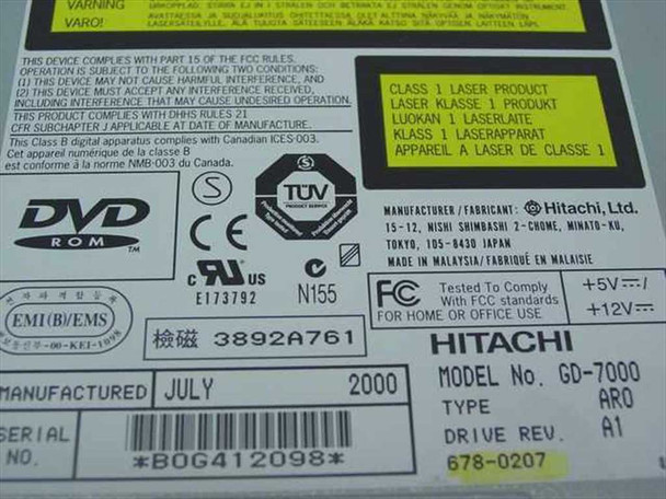 Hitachi GD-7000 bottom label showing model GD-7000 AR0, Drive Rev. A1, Apple part number 678-0207, manufactured July 2000, serial number B0G412098, made in Malaysia, FCC and TÜV certifications