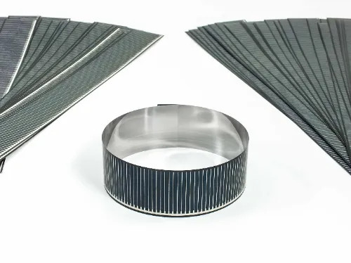Solopower flexible CIGS solar cells fanned out on both sides with one cell rolled into a cylindrical shape in the center, demonstrating flexibility