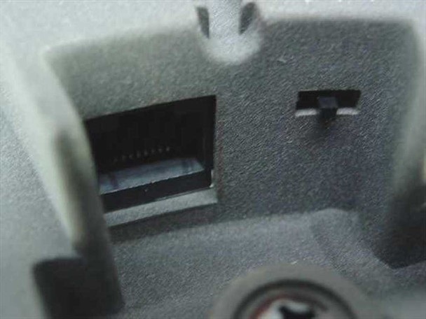 Polycom SoundStation bottom connector port detail showing RJ-11 style interface connection recess