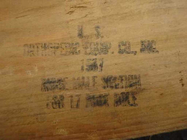 Close-up of stamp on wood pole reading U.S. Orthopedic Equip. Co. Inc. Ridge Half Section For 17 Foot Ridge