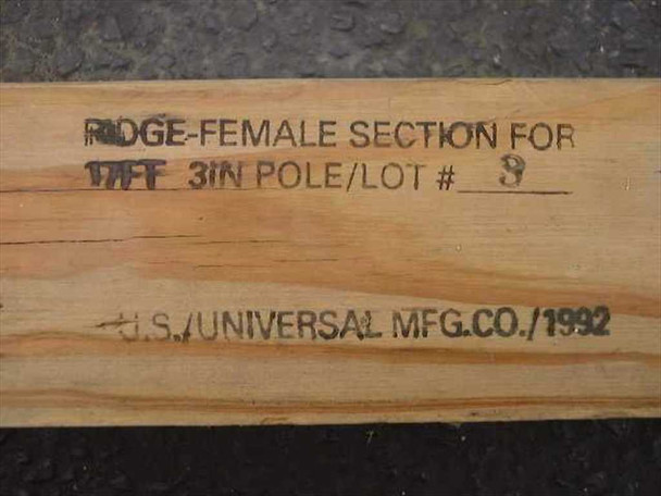 Close-up of stamp on wood pole reading Ridge-Female Section For 17ft 3in Pole Lot 8 U.S. Universal Mfg. Co. 1992