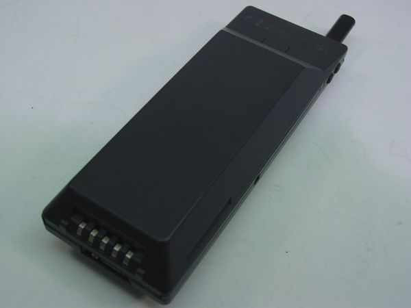 NEC MP5A1A3-1A analog mobile phone – rear view showing battery attached and stub antenna