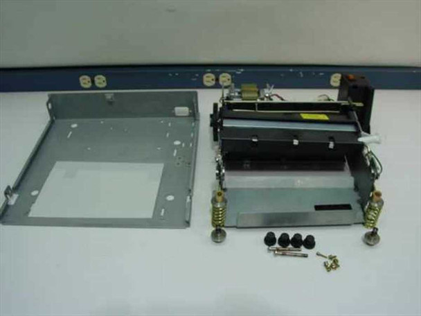 Disassembled Dataproducts Jolt showing steel base enclosure separated from the roller/heater mechanism assembly, with mounting hardware and rubber feet laid out