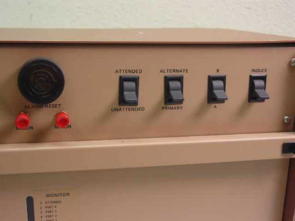 CMC Alarm-Matic System 4000 front panel right section showing Attended/Unattended, Alternate/Primary, A/B, and Induce toggle switches with Alarm Reset button and Major/Minor lamps