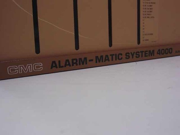 CMC Alarm-Matic System 4000 nameplate close-up showing CMC logo and Alarm-Matic System 4000 branding on front bottom rail