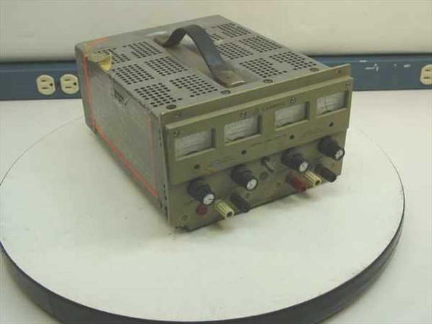Lambda LPD-422A-FM Dual Regulated Bench Power Supply — three-quarter front view showing analog panel meters and output binding posts, overall worn olive-drab enclosure with carry handle